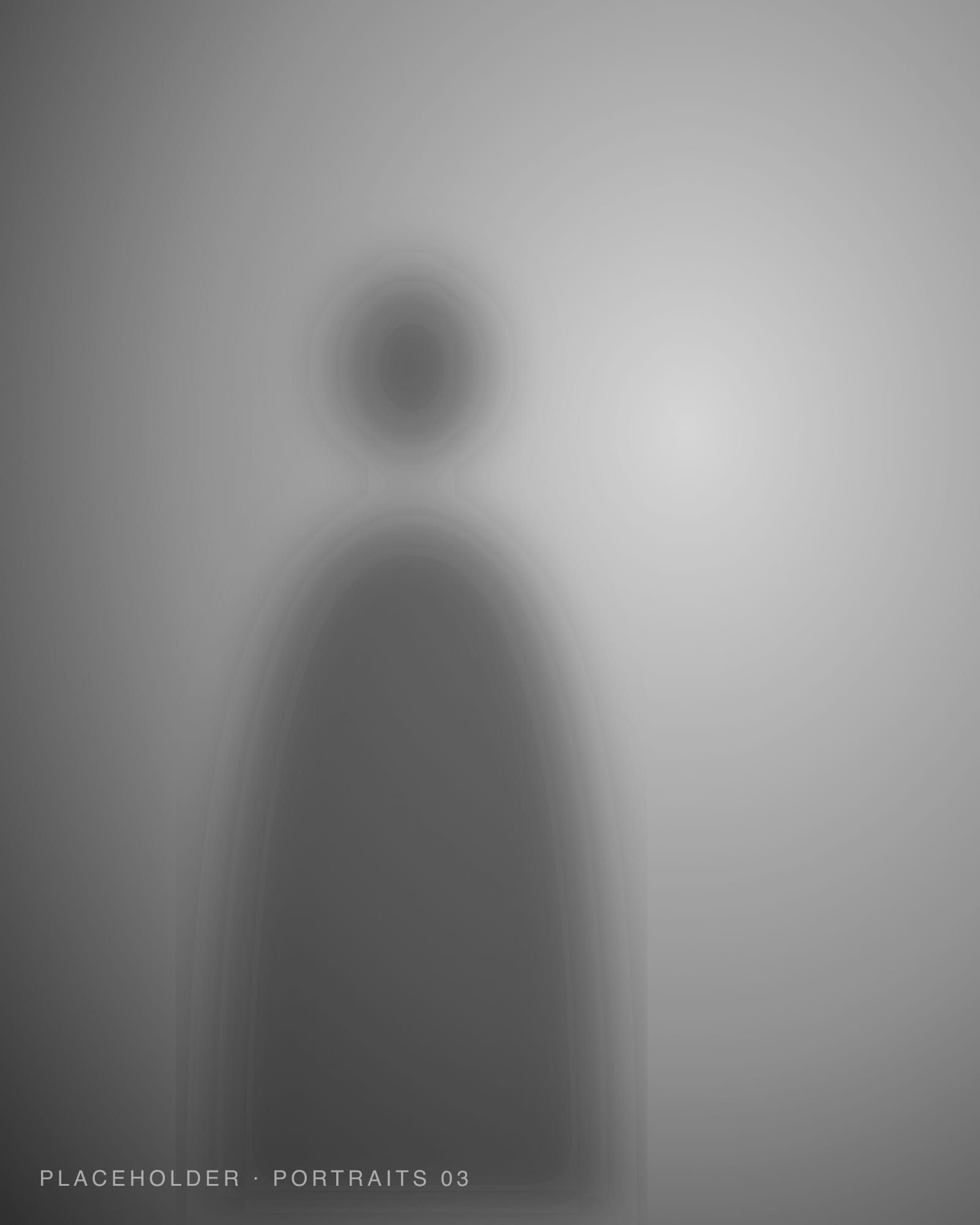 Close black and white portrait with soft shadow across the face