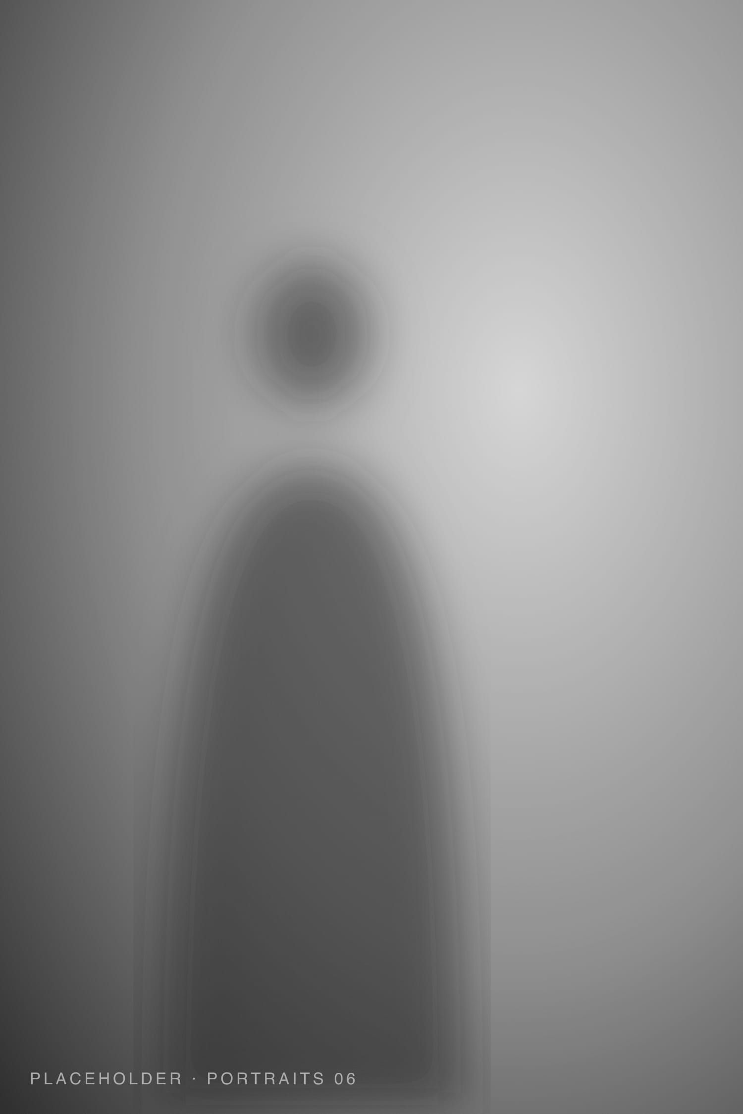 Standing black and white portrait with strong negative space